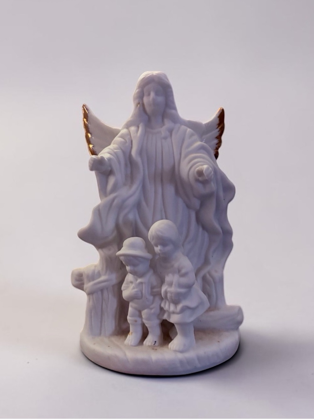 White Porcelain Guardian Angel Figurine with Gold-Trimmed Wings